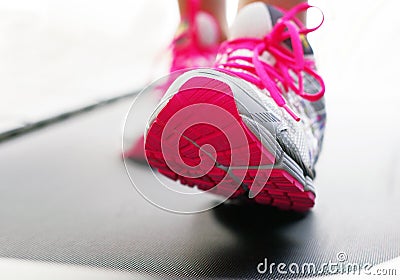 Feet on treadmill with bright shoes Stock Photo