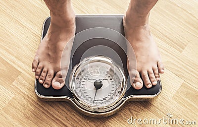 Feet with weight scale Stock Photo