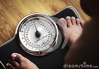 Feet with weight scale Stock Photo