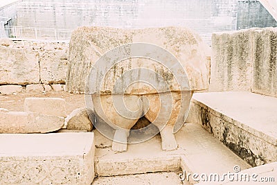 Feet of a woman, fragment of a huge statue of the mother goddess in Tarxien temple in Malta Stock Photo