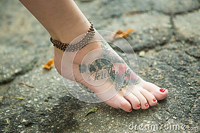 Feet of women in ethnic ornaments Stock Photo