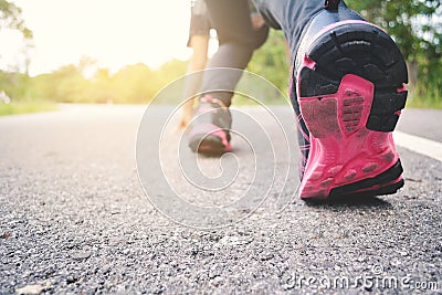 Feet women running on the road for health Stock Photo