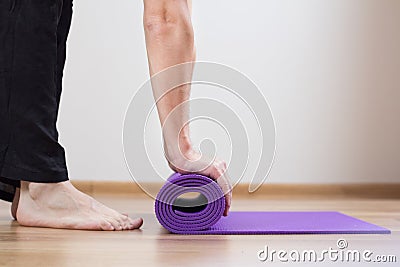 Feet and yoga mat Stock Photo