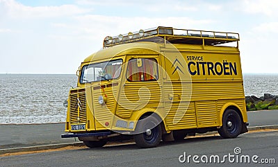 Classic yellow Citroen Hy Van with Service Citroen logo on the side parked on seafront promenade. Editorial Stock Photo