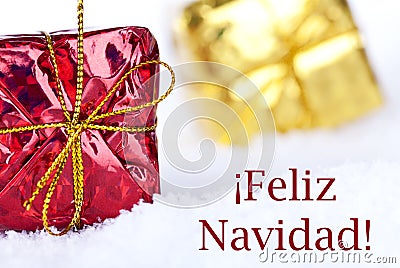 Feliz Navidad in the Snow with Gifts Stock Photo