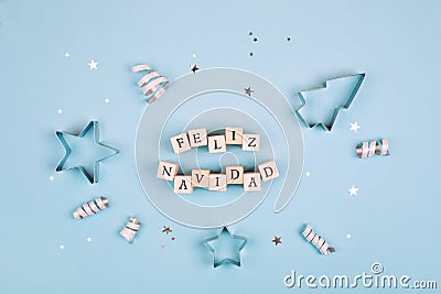 Feliz Navidad text on pastel blue background Stock Photo