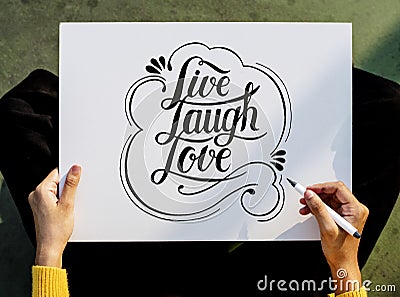 A female artist working on hand lettering Stock Photo