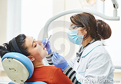 Female asian dentist doctor at work Stock Photo
