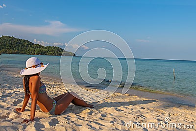 A female asian model relaxing in the sun on Sao Beach, Phu Quoc, Vietnam Stock Photo