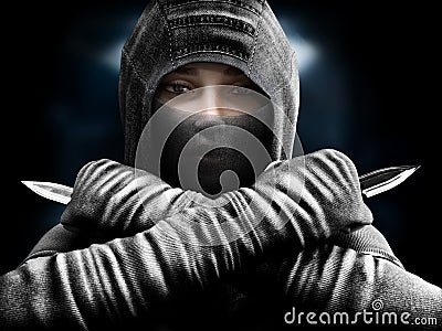 Female assassin slipping from the shadows closing in our her target. Stock Photo