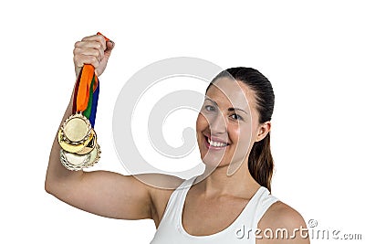 Female athlete posing with gold medals after victory Stock Photo