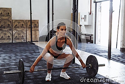 Female athlete preparing for deadlifting Stock Photo