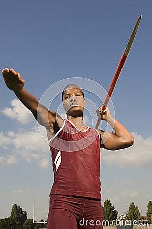 Female Athlete Ready To Throw Javelin Stock Photo