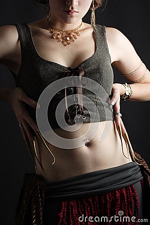 Female belly dancer with ornate clothing and jewelry Stock Photo