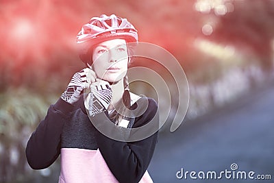 Female biker wearing bicycle helmet Stock Photo