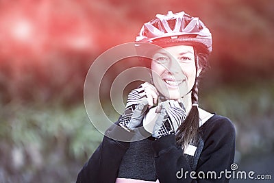 Female biker wearing bicycle helmet Stock Photo