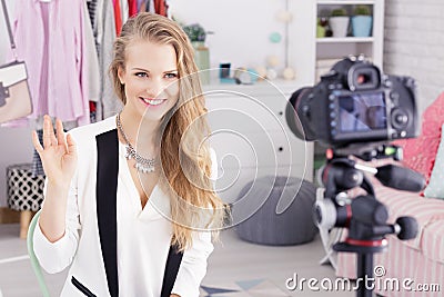 Female blogger greets fans Stock Photo