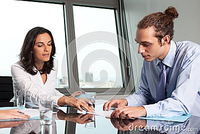 Female boss helping an intern Stock Photo