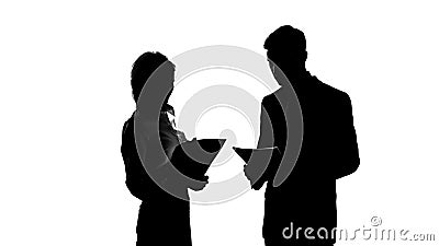 Female boss silhouette discussing business project with male secretary in office Stock Photo