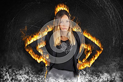 Female boss woman burning with rage. Very angry with fire flames and smoke Stock Photo