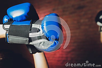 Female boxer with gloves up, close-up female hand. Stock Photo