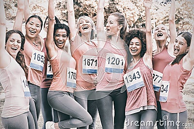 Female breast cancer marathon runners cheering Stock Photo