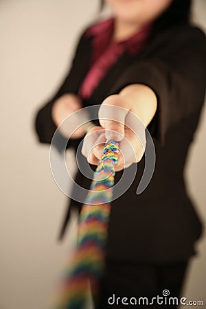 Female businesswoman pulling rope Stock Photo