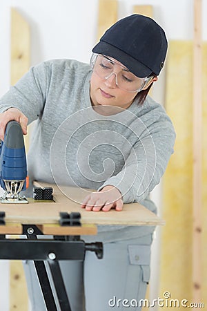 Female carpentry entrepreneur working hard Stock Photo