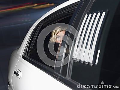 Female Celebrity Inside The Limo Car Stock Photo