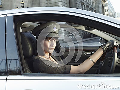Female Chauffeur Driving A Car Stock Photo