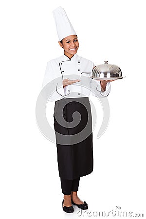 Female Chef With Tray Of Food In Hand Stock Photo