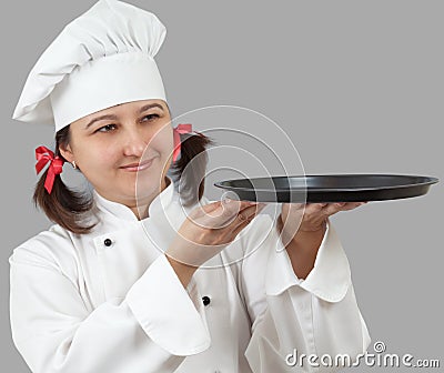 Female chef with a tray. Stock Photo