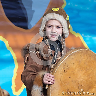 Female child dancing with tambourine in tradition clothing aborigine people Kamchatka. Celebration Koryak national holiday Hololo Editorial Stock Photo