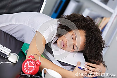 female clerical worker asleep at desk Stock Photo