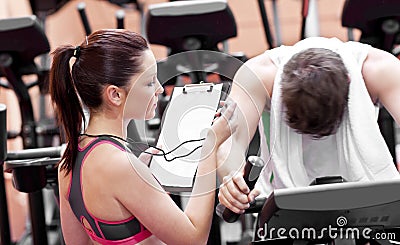 Female coach using a chronometer Stock Photo