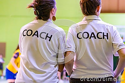 Female coaches in white COACH shirt Editorial Stock Photo