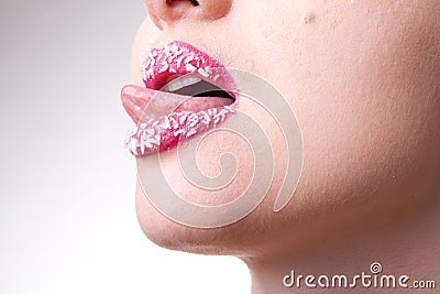 Female with coconut shaving over her lips Stock Photo