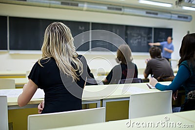 Female college student sitting in a classroom Stock Photo