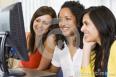 Female college students in a computer lab Stock Photo