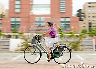 Female commuter cycling Stock Photo