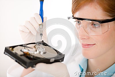 Female computer engineer - woman repair hard disc Stock Photo