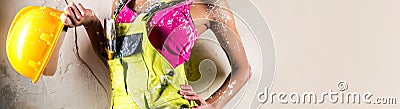 Cropped horizontal view female construction worker holding helmet Stock Photo