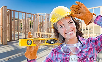 Female Construction Worker Holding Level Wearing Gloves, Hard Ha Stock Photo