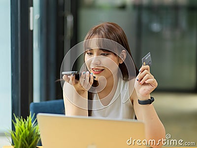 Female contact with credit card call centre service Stock Photo