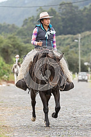 Female cowboy on horse back in Ecuador Editorial Stock Photo
