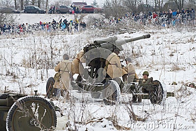 The female crew of an antiaircraft gun prepares for fight Editorial Stock Photo