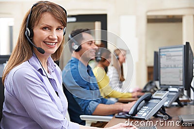Female Customer Services Agent In Call Centre Stock Photo