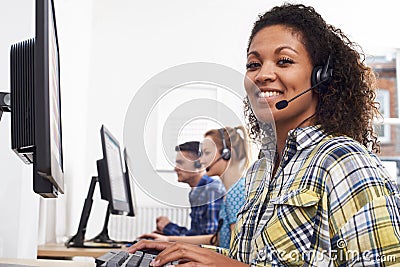 Female Customer Services Agent In Call Centre Stock Photo