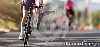 Female cyclist riding racing bicycle Stock Photo