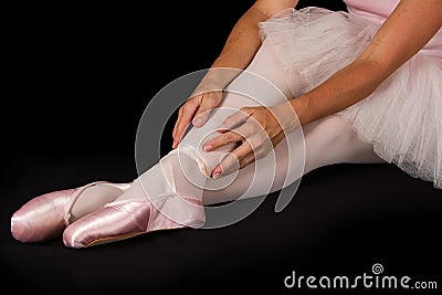 Female dancer sit on floor in pink tutu Stock Photo